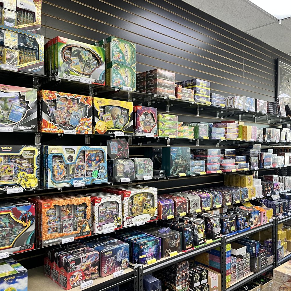 A local game store with Pokemon card products on the shelves